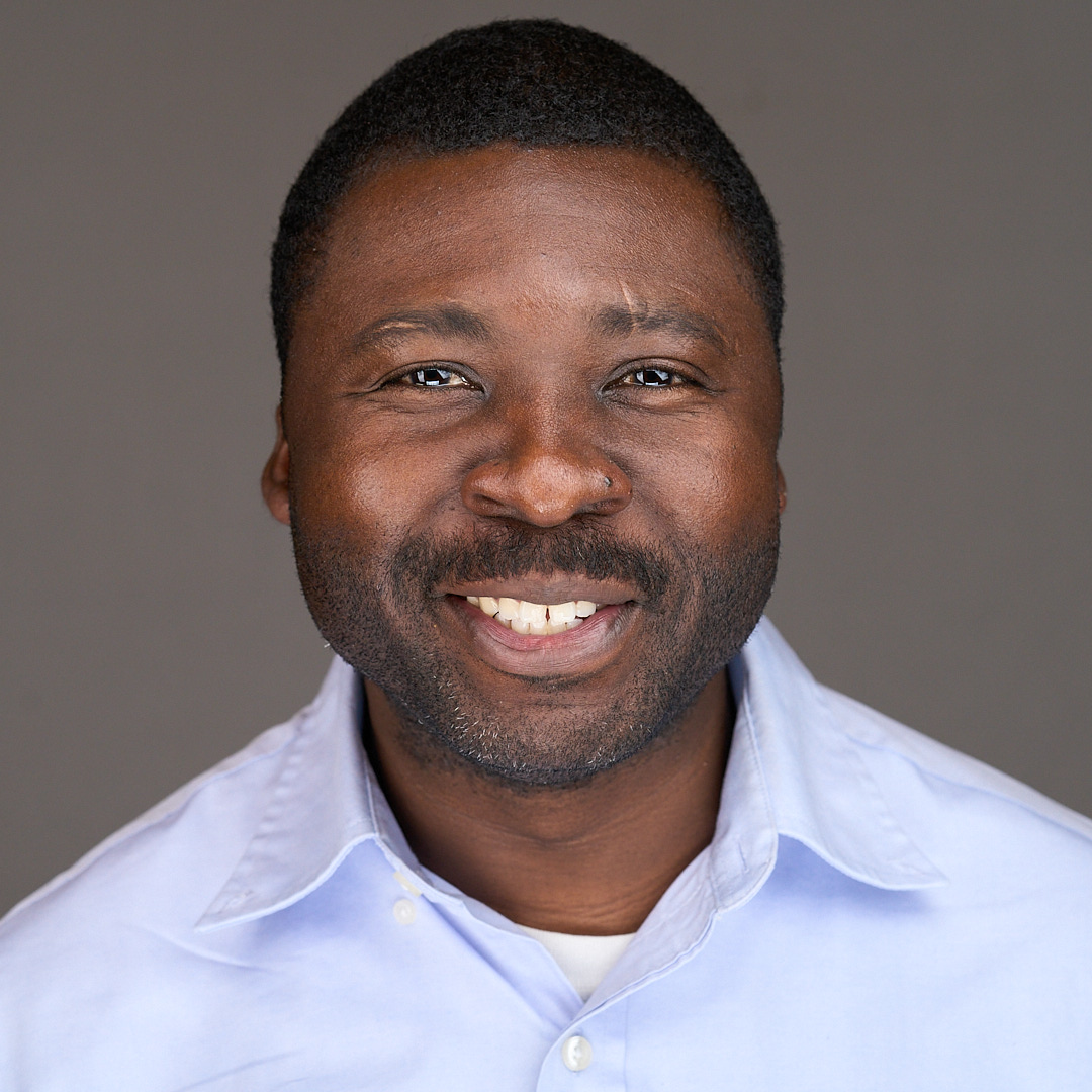 Web site designer and developer Eric Mack smiles